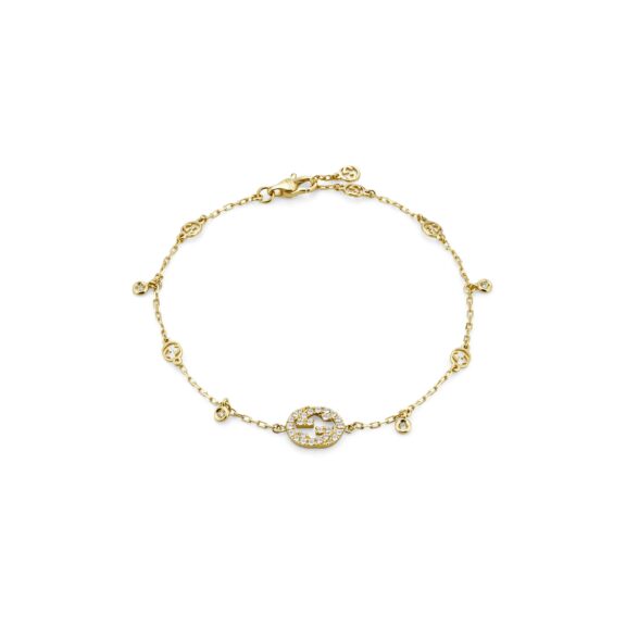Interlocking Armschmuck von Gucci aus 18 Karat Gelbgold mit Diamanten