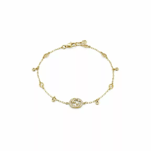 Interlocking Armschmuck von Gucci aus 18 Karat Gelbgold mit Diamanten