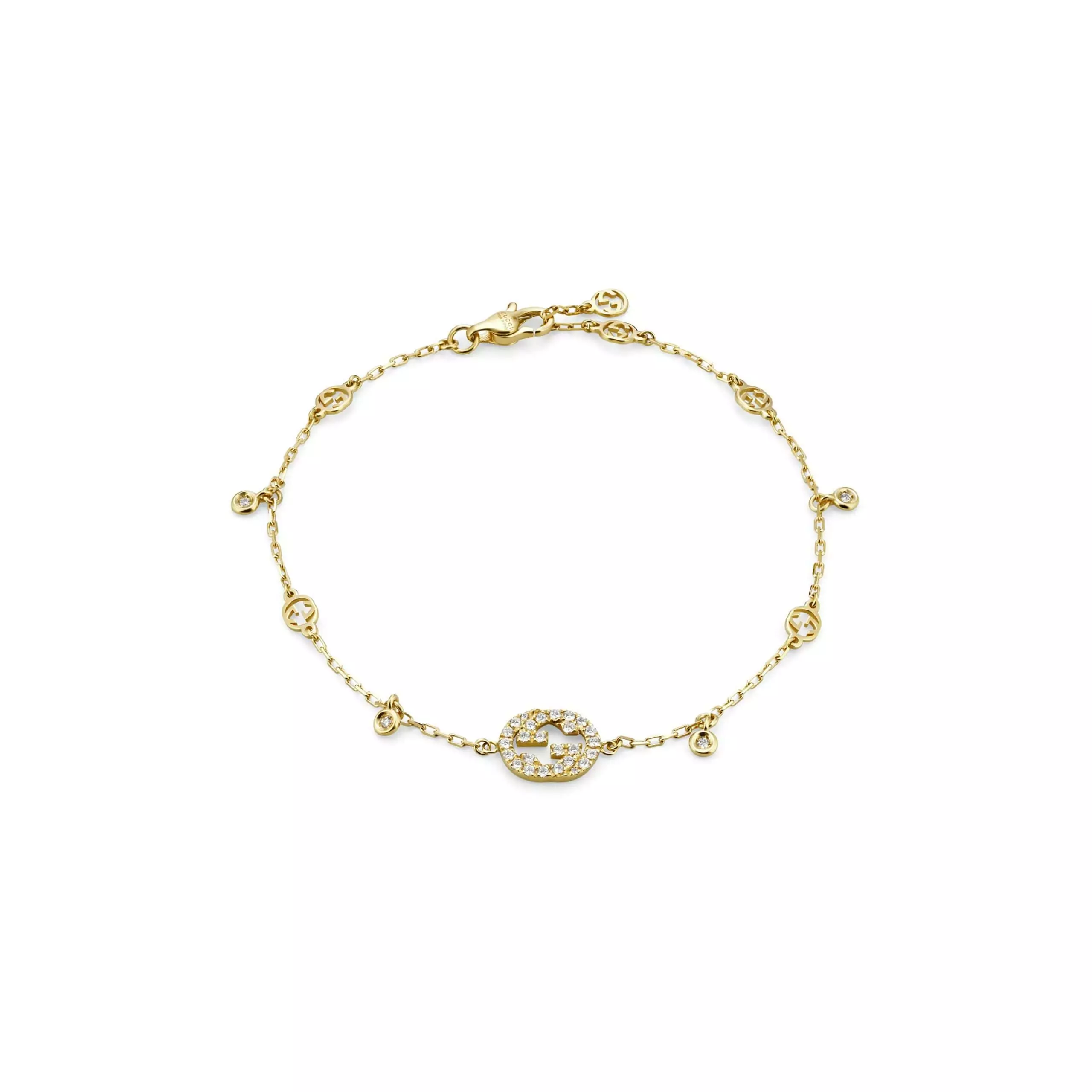Interlocking Armschmuck von Gucci aus 18 Karat Gelbgold mit Diamanten