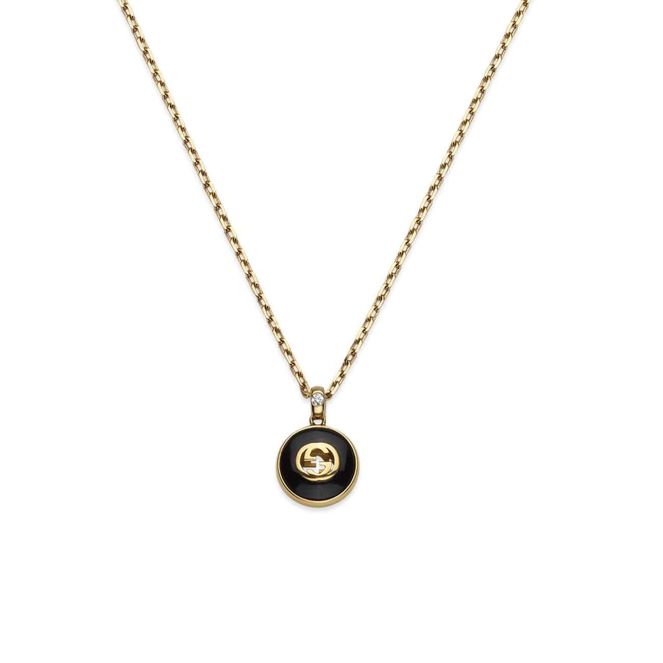 Interlocking Collier von Gucci aus 18 Karat Gelbgold mit Onyx und Diamant