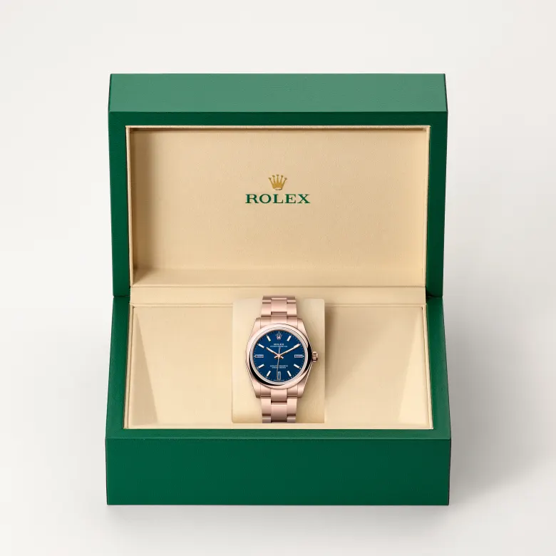 Rolex Oyster Perpetual in 18 Karat Everose-Gold in grüner Schatulle
