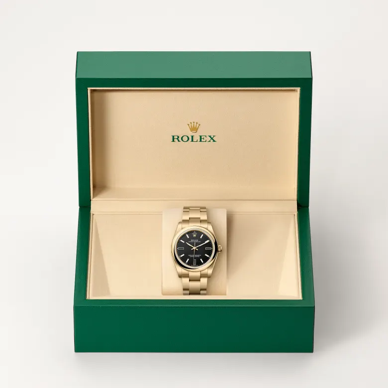 Rolex Oyster Perpetual in 18 Karat Gelbgold in grüner Schatulle
