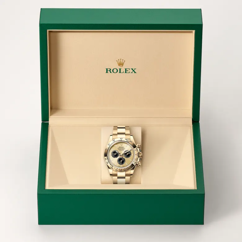 Rolex Cosmograph Daytona in 18 Karat Gelbgold in grüner Schatulle