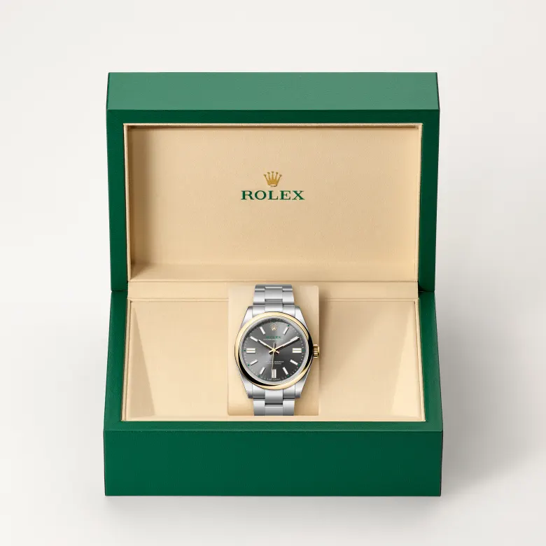 Rolex Oyster Perpetual in Rolesor gelb (Kombination aus Edelstahl Oystersteel und Gelbgold) in grüner Schatulle