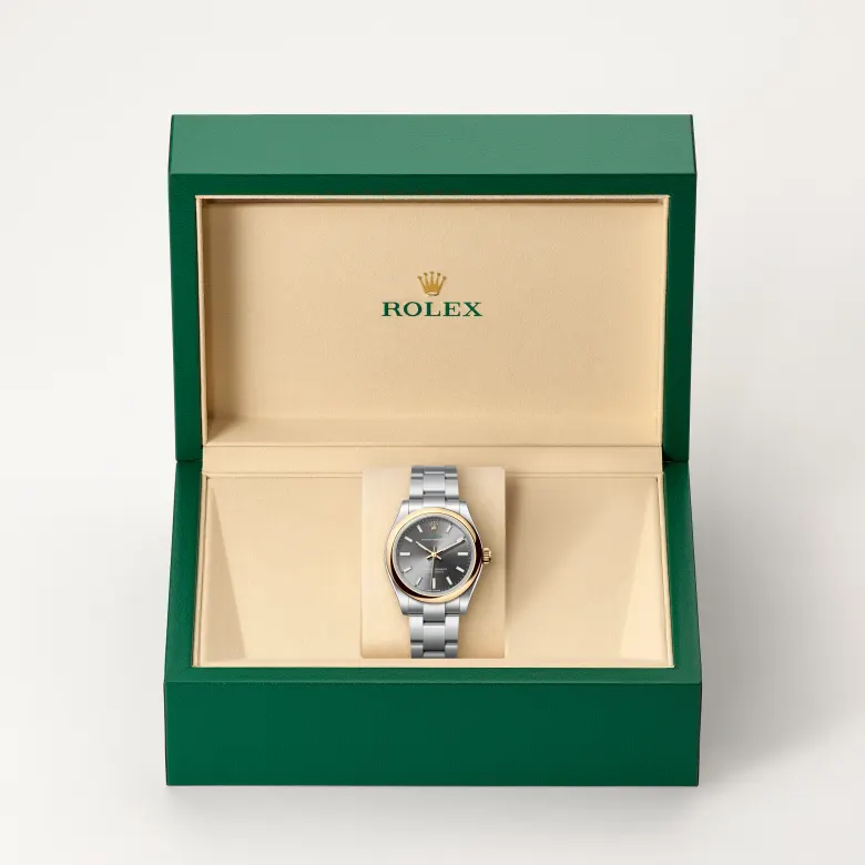 Rolex Oyster Perpetual in Rolesor gelb (Kombination aus Edelstahl Oystersteel und Gelbgold) in grüner Schatulle