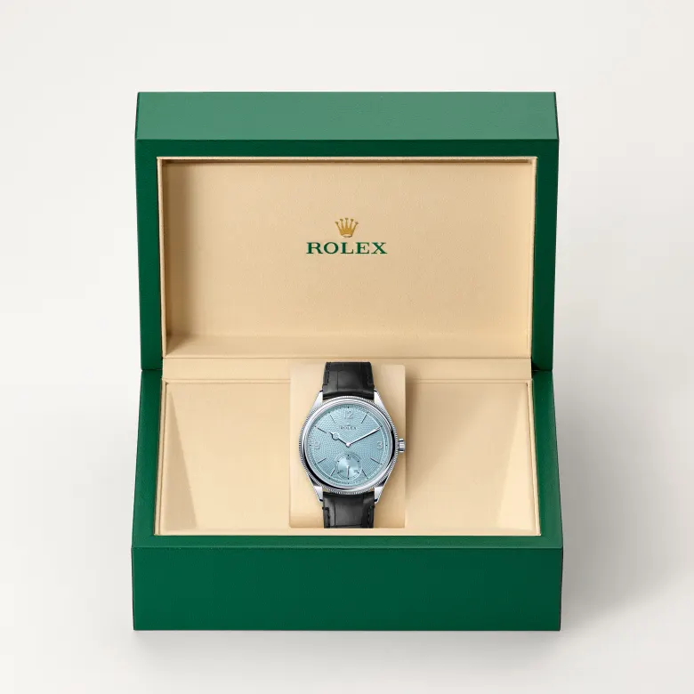 Rolex 1908 in Platin in grüner Schatulle